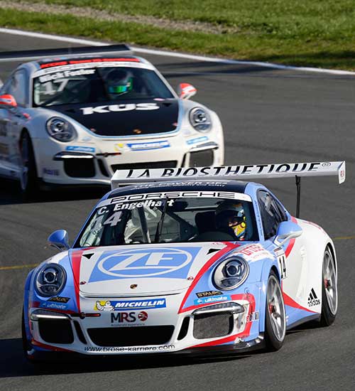 Porsche 911 duel on the race track at the Porsche Supercup.